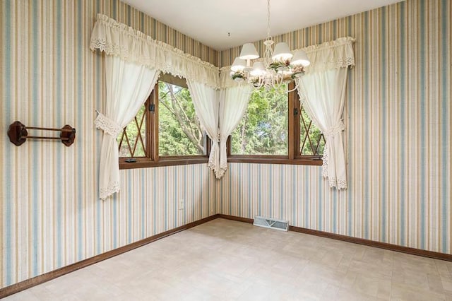 5718 Tasselbury Close, Rockford, IL 61114 - unfurnished room with tile patterned floors and a chandelier
