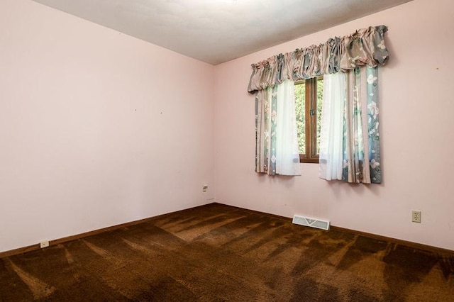 5718 Tasselbury Close, Rockford, IL 61114 - empty room featuring dark carpet and baseboards
