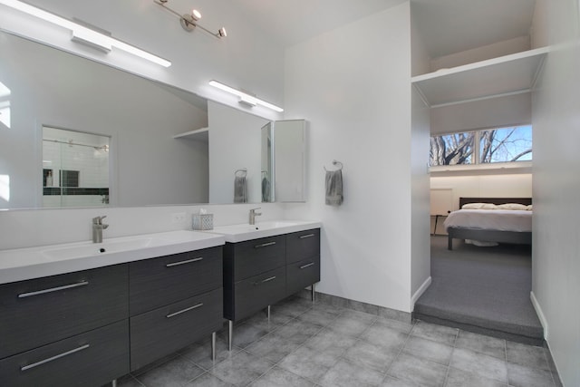 241 E Burlington St Unit C, Riverside, IL 60546 - full bath featuring two vanities, a stall shower, and baseboards