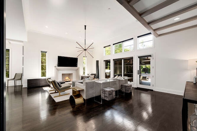 31 Concord Dr, Oak Brook, IL 60523 - living room featuring a lit fireplace, wood finished floors, a towering ceiling, recessed lighting, and baseboards