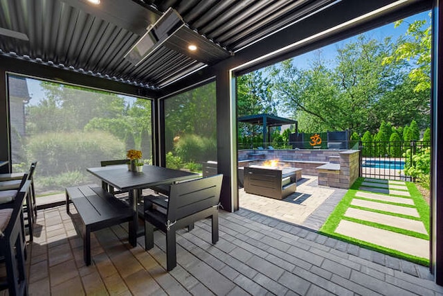 31 Concord Dr, Oak Brook, IL 60523 - view of patio / terrace with an outdoor fire pit, outdoor dining area, and a fenced backyard