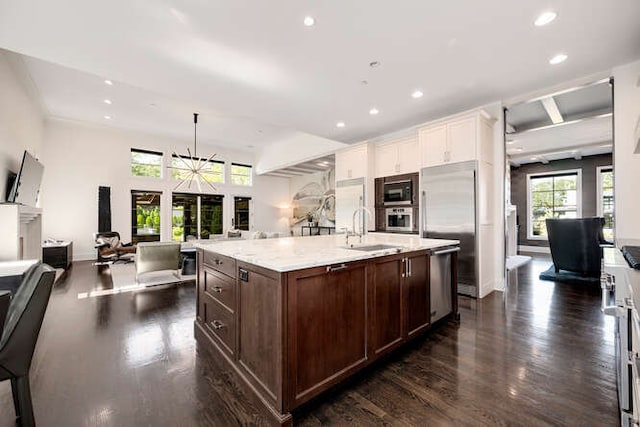31 Concord Dr, Oak Brook, IL 60523 - kitchen featuring built in appliances, dark wood finished floors, white cabinets, open floor plan, and recessed lighting
