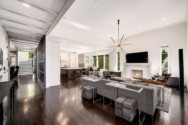 31 Concord Dr, Oak Brook, IL 60523 - living room featuring healthy amount of natural light, dark wood-style flooring, a lit fireplace, and recessed lighting