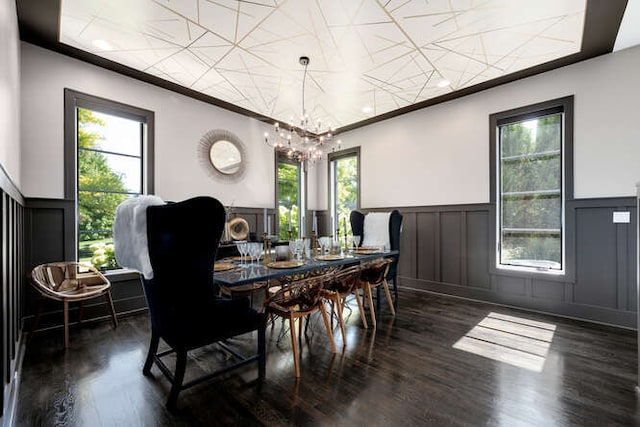 31 Concord Dr, Oak Brook, IL 60523 - dining room featuring a decorative wall, a wainscoted wall, wood finished floors, a chandelier, and plenty of natural light