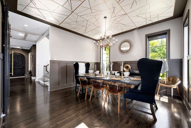31 Concord Dr, Oak Brook, IL 60523 - dining area with a decorative wall, a wainscoted wall, a chandelier, wood finished floors, and crown molding