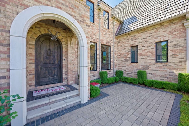 31 Concord Dr, Oak Brook, IL 60523 - view of exterior entry with brick siding and a high end roof