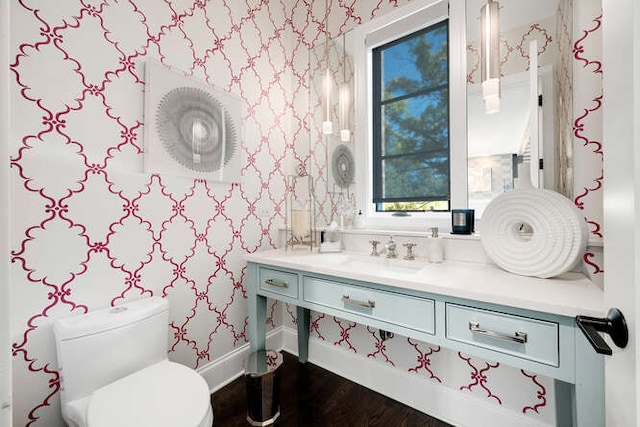 31 Concord Dr, Oak Brook, IL 60523 - bathroom with wallpapered walls, wood finished floors, vanity, toilet, and baseboards