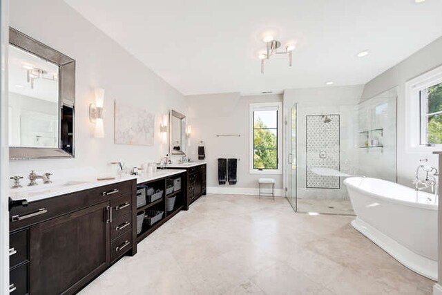 31 Concord Dr, Oak Brook, IL 60523 - bathroom featuring a stall shower, a freestanding tub, and two vanities