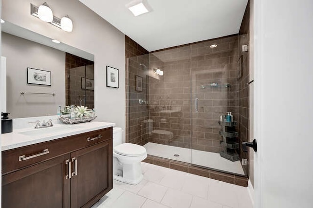 31 Concord Dr, Oak Brook, IL 60523 - full bathroom featuring a shower stall, toilet, vanity, and tile patterned flooring