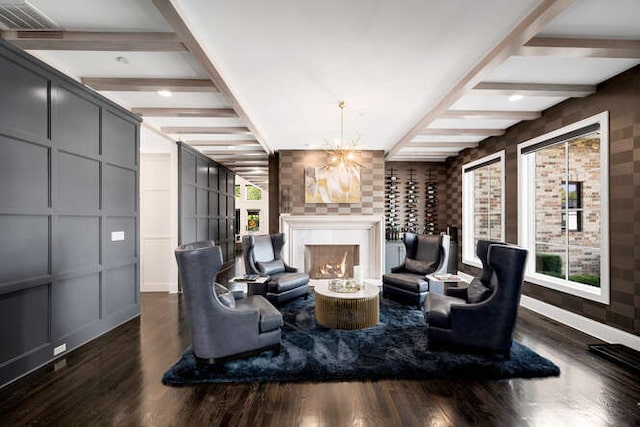 31 Concord Dr, Oak Brook, IL 60523 - living room featuring beam ceiling, wood finished floors, a chandelier, a lit fireplace, and a decorative wall