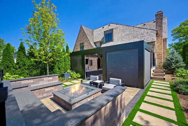 31 Concord Dr, Oak Brook, IL 60523 - rear view of property featuring an outdoor fire pit and a chimney