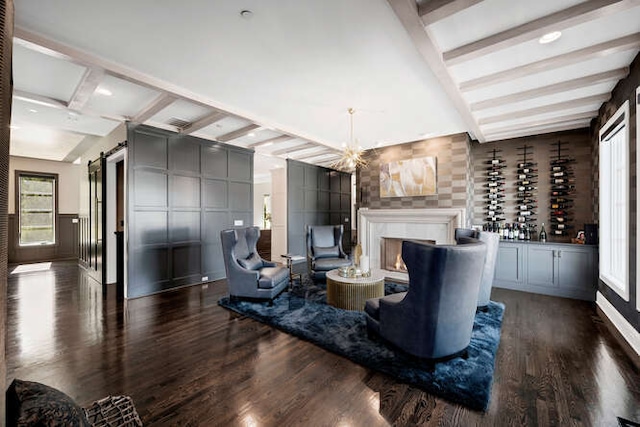 31 Concord Dr, Oak Brook, IL 60523 - living area featuring wood finished floors, a barn door, a decorative wall, and a chandelier