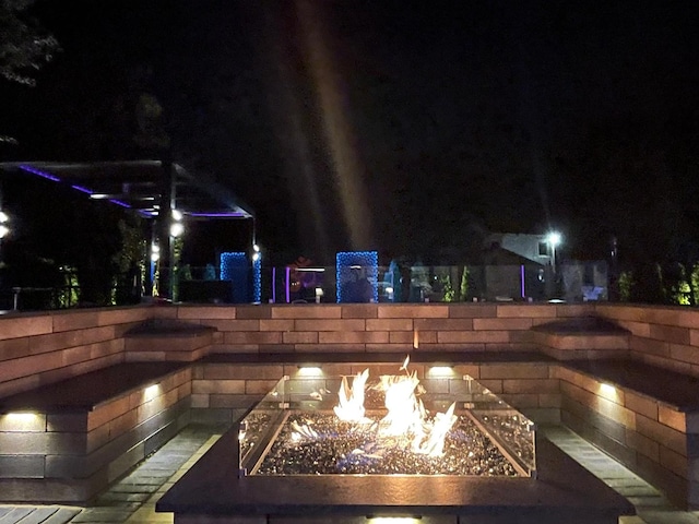 31 Concord Dr, Oak Brook, IL 60523 - pool at night with a fire pit