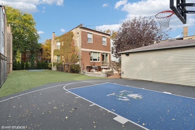 4845 N Bell Ave, Chicago, IL 60625 - view of basketball court featuring basketball court and a lawn