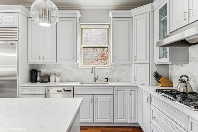 4845 N Bell Ave, Chicago, IL 60625 - kitchen featuring a sink, stainless steel appliances, white cabinets, glass insert cabinets, and ornamental molding