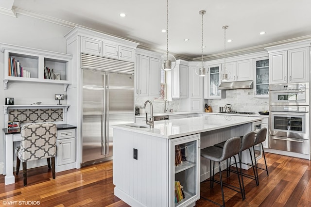 4845 N Bell Ave, Chicago, IL 60625 - kitchen with appliances with stainless steel finishes, a warming drawer, open shelves, under cabinet range hood, and a sink