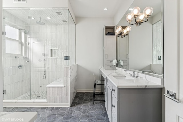 4845 N Bell Ave, Chicago, IL 60625 - full bath with a chandelier, a stall shower, recessed lighting, vanity, and tile patterned floors