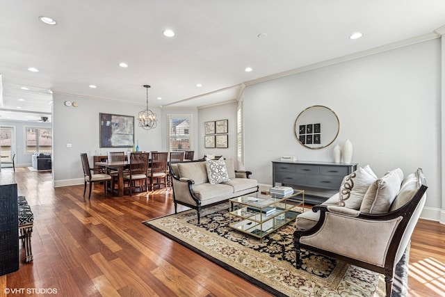 4845 N Bell Ave, Chicago, IL 60625 - living area featuring ornamental molding, wood finished floors, recessed lighting, a chandelier, and baseboards