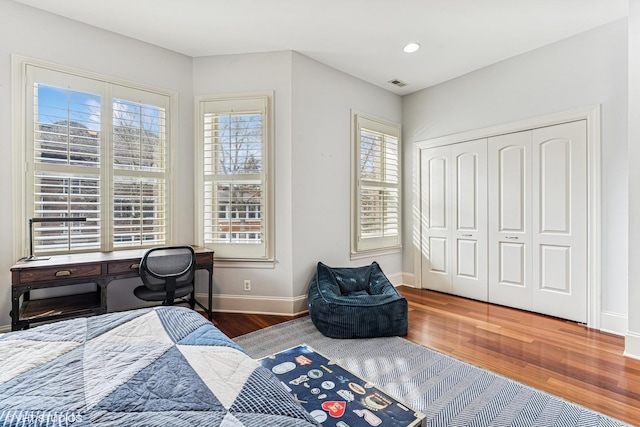 4845 N Bell Ave, Chicago, IL 60625 - bedroom featuring wood finished floors, baseboards, a closet, and recessed lighting