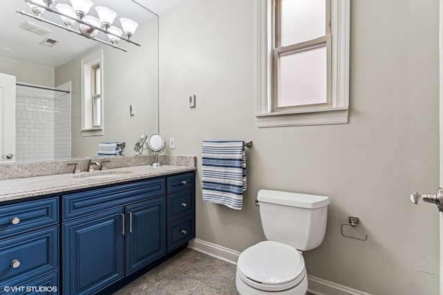 4845 N Bell Ave, Chicago, IL 60625 - full bathroom featuring baseboards, toilet, vanity, and a shower