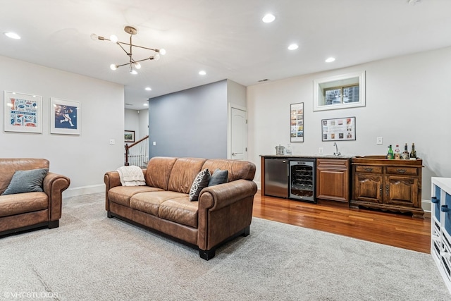 4845 N Bell Ave, Chicago, IL 60625 - carpeted living area with beverage cooler, wet bar, recessed lighting, a chandelier, and wood finished floors