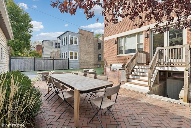 4845 N Bell Ave, Chicago, IL 60625 - view of patio / terrace with outdoor dining area, area for grilling, fence, and an outdoor kitchen