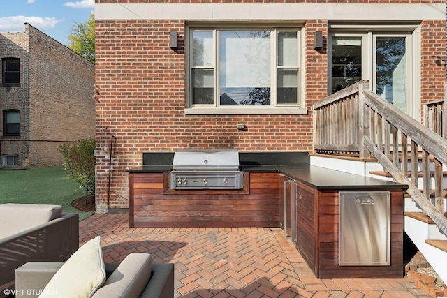 4845 N Bell Ave, Chicago, IL 60625 - view of patio featuring grilling area and an outdoor kitchen