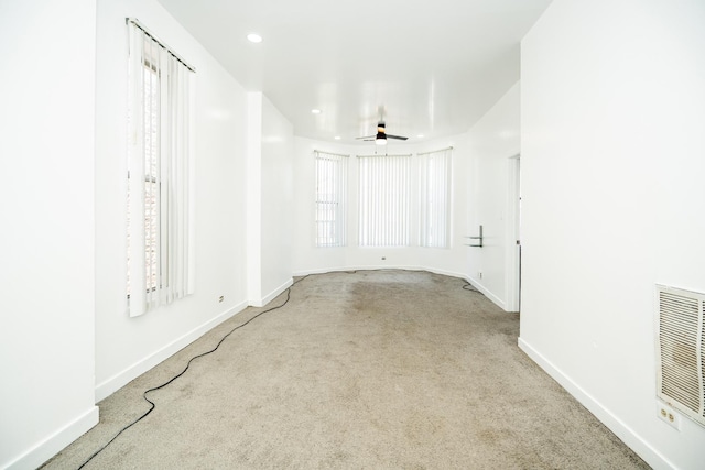 3929 W Arthington St, Chicago, IL 60624 - carpeted spare room with baseboards, plenty of natural light, a ceiling fan, and recessed lighting