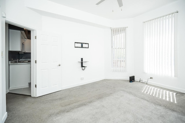 3929 W Arthington St, Chicago, IL 60624 - unfurnished bedroom with carpet floors, baseboards, and ceiling fan