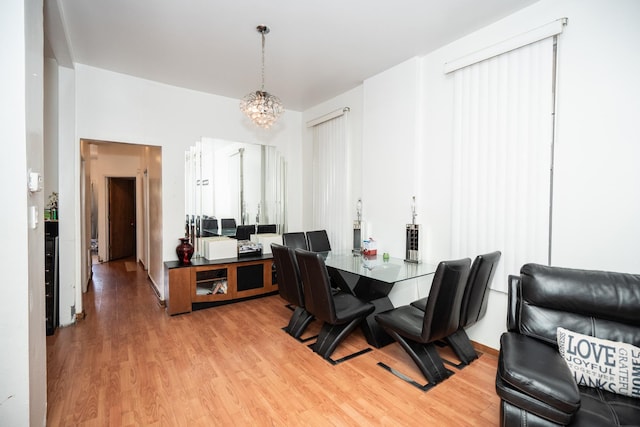 3929 W Arthington St, Chicago, IL 60624 - dining room with light wood finished floors and a chandelier