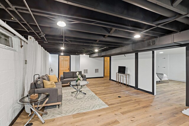 785 E 164th St, South Holland, IL 60473 - living area with wood finished floors, concrete block wall, and baseboards