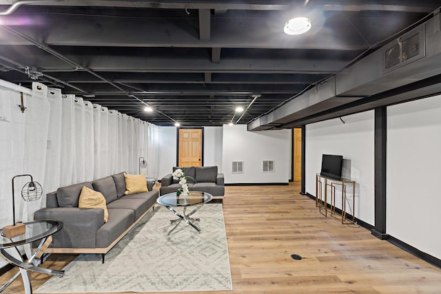785 E 164th St, South Holland, IL 60473 - living room featuring baseboards and light wood-style floors