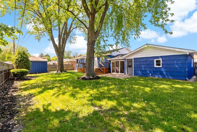 785 E 164th St, South Holland, IL 60473 - view of yard with an outbuilding, a deck, and a shed