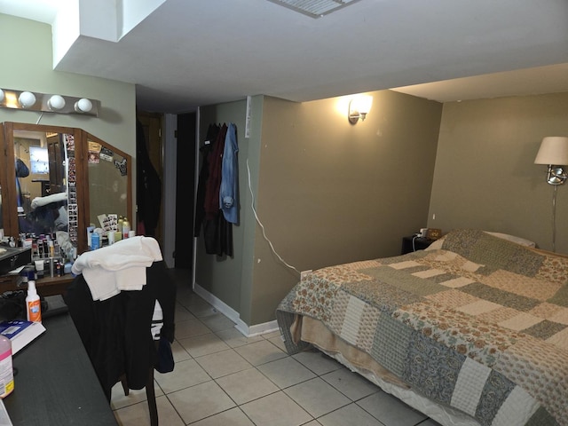 948 N California Ave, Chicago, IL 60622 - bedroom featuring light tile patterned floors and baseboards