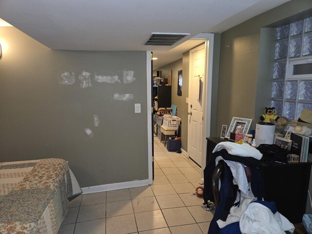 948 N California Ave, Chicago, IL 60622 - bedroom with light tile patterned floors and baseboards