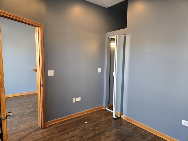 948 N California Ave, Chicago, IL 60622 - empty room featuring dark wood finished floors and baseboards