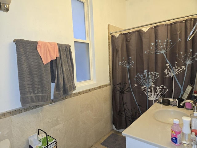 948 N California Ave, Chicago, IL 60622 - bathroom with tile walls, a wainscoted wall, vanity, and curtained shower