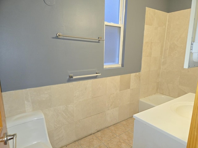 948 N California Ave, Chicago, IL 60622 - full bathroom featuring tile walls, tile patterned floors, vanity, and wainscoting