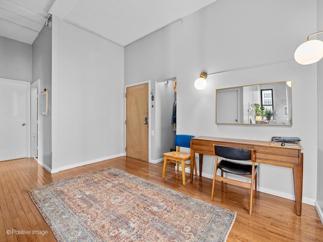 600 S Dearborn St Unit 302, Chicago, IL 60605 - sitting room featuring a towering ceiling, wood finished floors, and baseboards