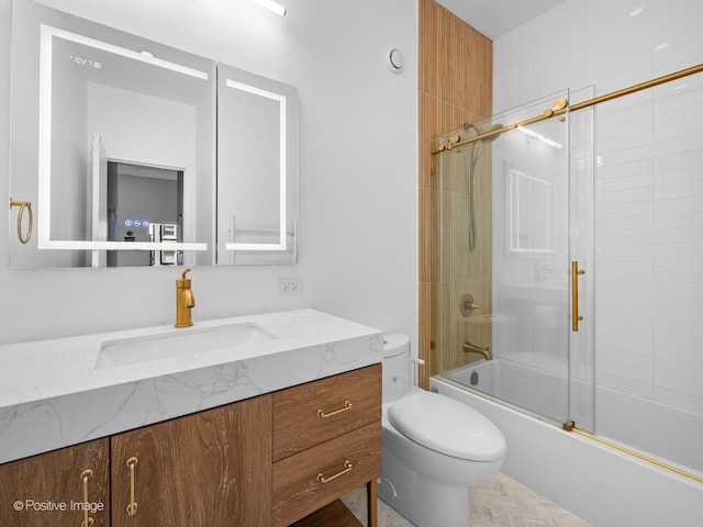 600 S Dearborn St Unit 302, Chicago, IL 60605 - bathroom featuring toilet, vanity, and bath / shower combo with glass door