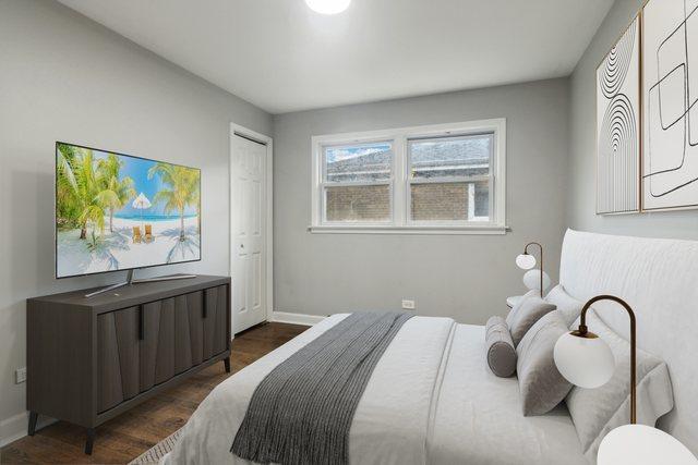 15123 Wabash Ave, South Holland, IL 60473 - bedroom with dark wood-type flooring and baseboards