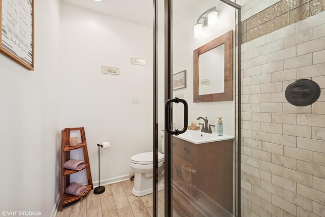 713 Sylviawood Ave, Park Ridge, IL 60068 - full bath with toilet, vanity, wood finished floors, baseboards, and a tile shower