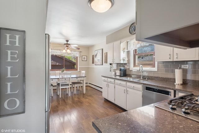 713 Sylviawood Ave, Park Ridge, IL 60068 - kitchen with a sink, appliances with stainless steel finishes, ceiling fan, white cabinets, and dark wood finished floors