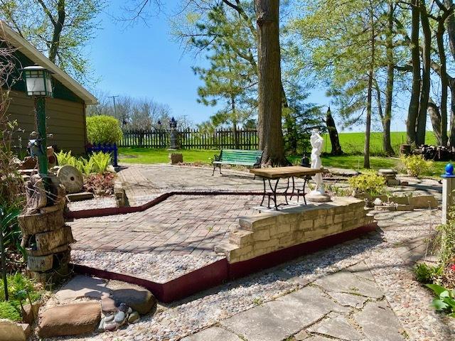 view of community featuring a patio and fence