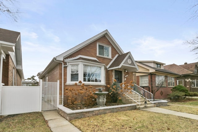 3305 W 66th St, Chicago, IL 60629 - view of front of home with brick siding and a gate