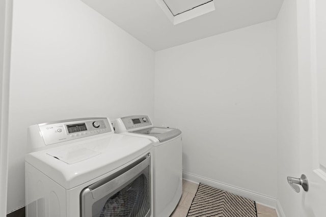 2319 Coventry Cir, Sycamore, IL 60178 - clothes washing area with washer and clothes dryer, baseboards, and light tile patterned flooring