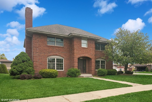 18321 Country Ln, Lansing, IL 60438 - view of front of property featuring a chimney, a front yard, brick siding, and roof with shingles