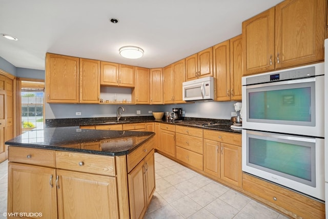 18321 Country Ln, Lansing, IL 60438 - kitchen with white appliances, a sink, dark stone counters, light tile patterned floors, and a center island