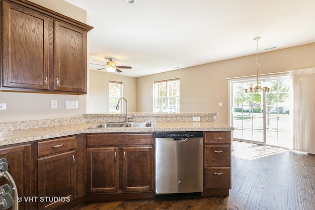 kitchen featuring stainless steel dishwasher, a sink, a ceiling fan, a peninsula, and dark wood finished floors