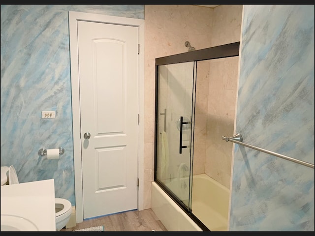 1908 Linden Ave, Waukegan, IL 60087 - bathroom featuring toilet, shower / bath combination with glass door, and wood finished floors
